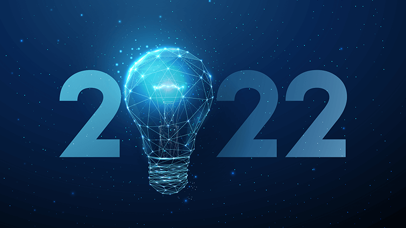 A digital light bulb illustration with a network pattern overlay, flanked by the numbers "2022" against a starry blue background, symbolizing innovation and ideas in the year 2022.
