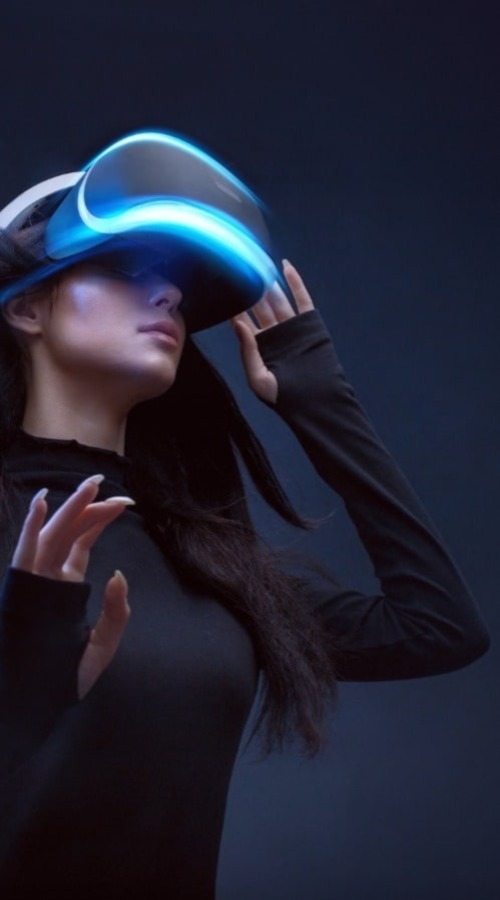 A woman immersed in virtual reality, wearing a futuristic headset, exploring a digital world.