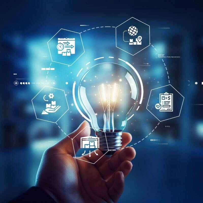 A hand holds a glowing light bulb with technology and innovation icons encircling it. The background is a blurred, modern workspace. Graphical hexagonal icons represent data analytics, global network, settings, and documents surrounding the bulb.