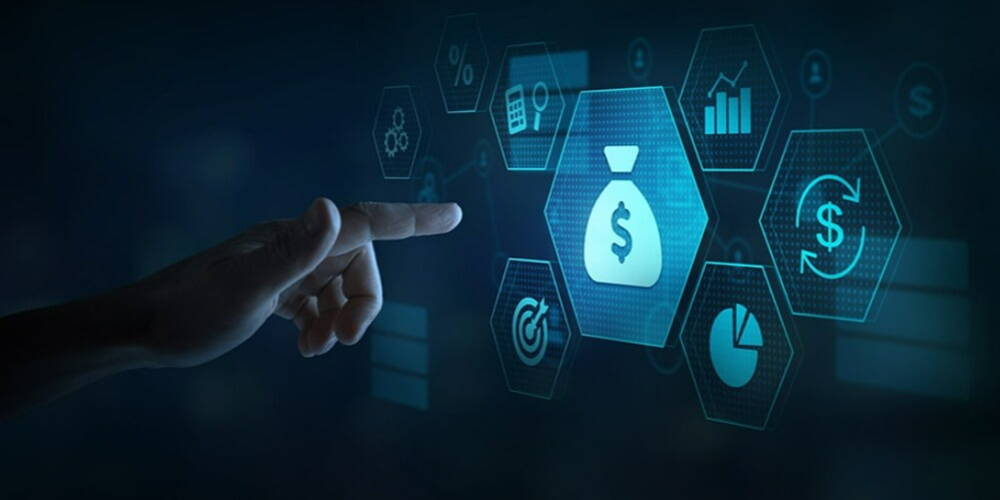 A hand interacting with futuristic digital financial icons including top paying currency symbols and graphs, illuminated in blue on a dark background.