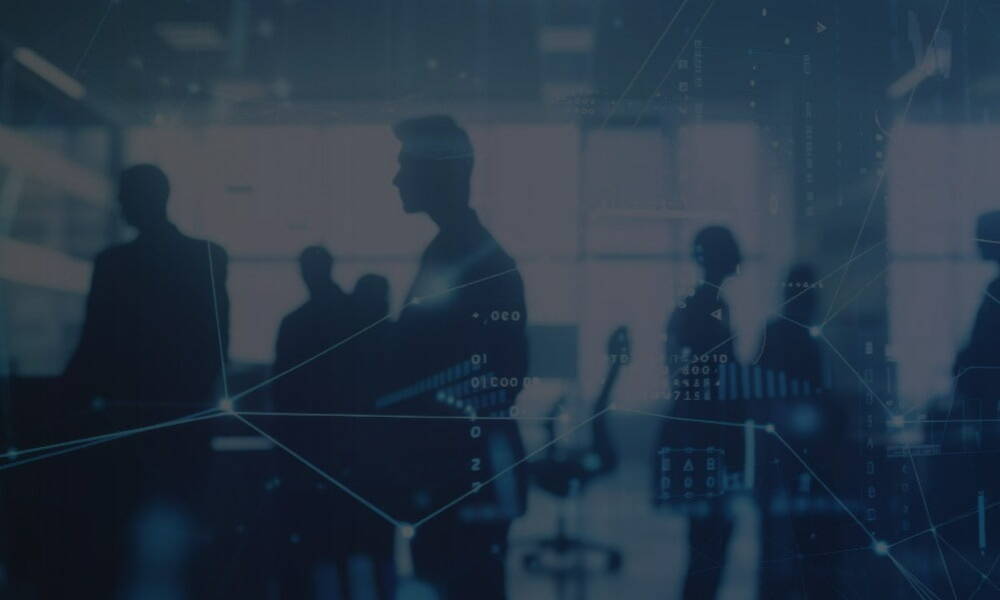 Silhouettes of people in an office setting with digital graphs and data overlays create a futuristic and analytical atmosphere.